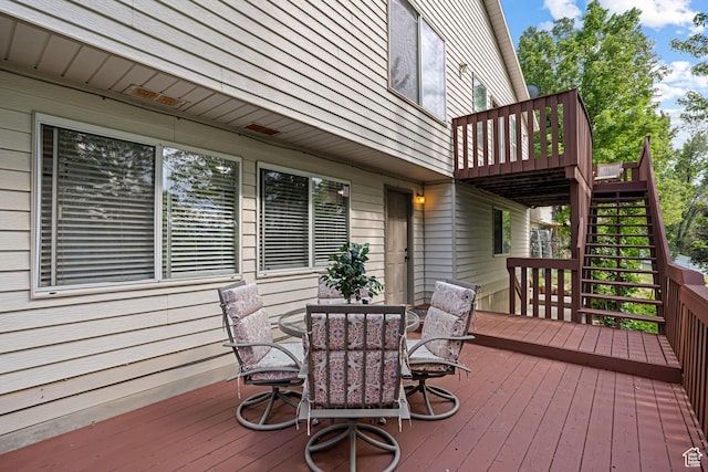 11770 S Dry Creek Rd, Sandy, UT 84094 - wooden deck with outdoor dining space and stairs
