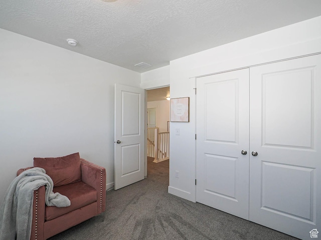 3022 S Shoreline Dr W, Syracuse, UT 84075 - living area featuring carpet, a textured ceiling, and baseboards