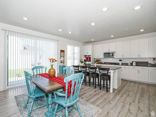 3022 S Shoreline Dr W, Syracuse, UT 84075 - dining room featuring light wood finished floors and recessed lighting