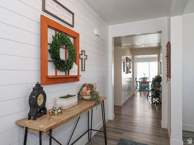 3022 S Shoreline Dr W, Syracuse, UT 84075 - hall featuring baseboards, wood finished floors, a textured ceiling, and wood walls