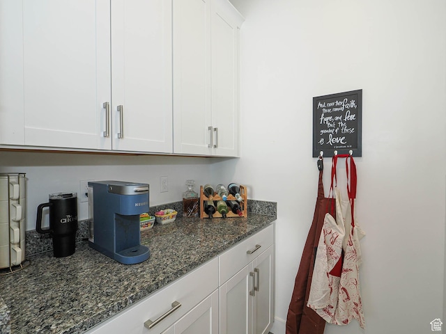 3022 S Shoreline Dr W, Syracuse, UT 84075 - kitchen featuring white cabinetry and dark stone countertops