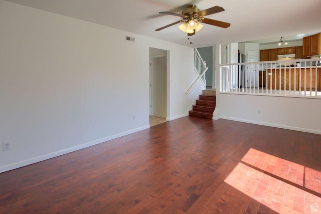 8183 S 2420 W, West Jordan, UT 84088 - unfurnished living room with ceiling fan, wood finished floors, baseboards, and stairs