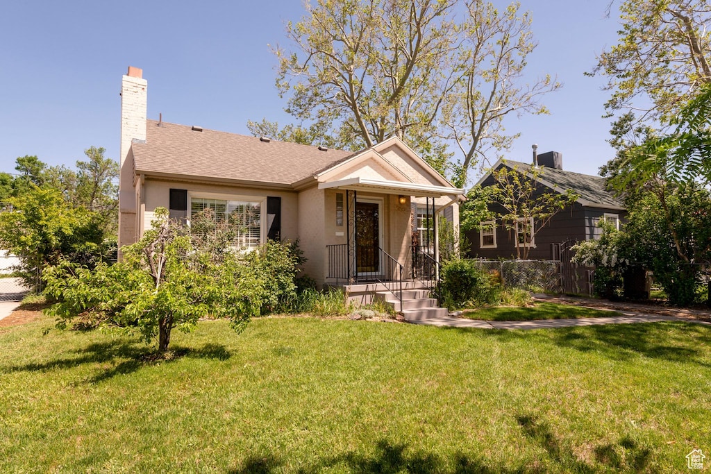 2527 S Hartford St E, Salt Lake City, UT 84106 - view of front of property featuring a chimney and stucco siding