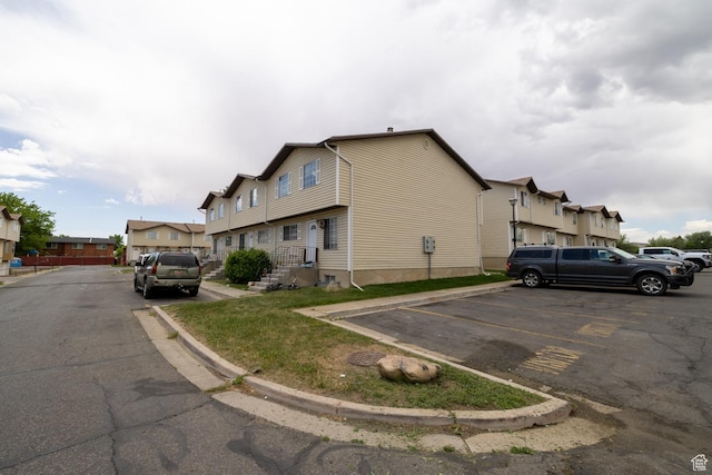 1350 W 150 N Unit 21, Vernal, UT 84078 - view of side of home with uncovered parking and a residential view