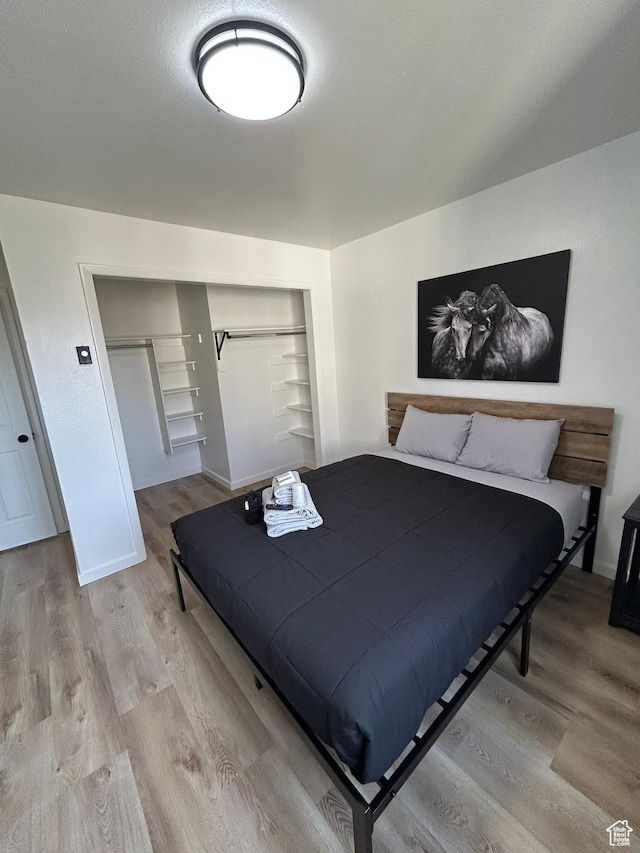 1350 W 150 N Unit 22, Vernal, UT 84078 - bedroom with wood finished floors, a closet, and baseboards