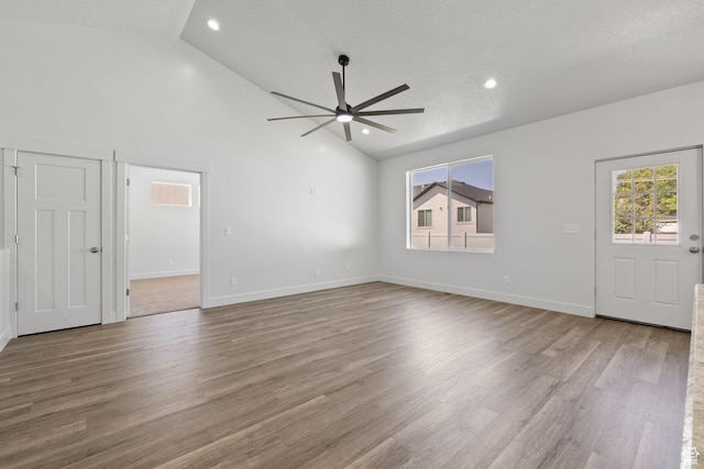 387 N 300 E, Payson, UT 84651 - unfurnished living room featuring ceiling fan, wood finished floors, recessed lighting, and high vaulted ceiling