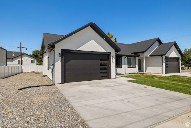 387 N 300 E, Payson, UT 84651 - view of front of house featuring a garage, stucco siding, and concrete driveway