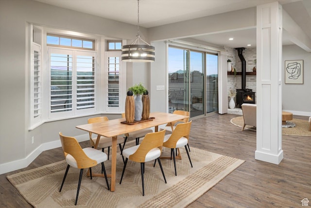 1697 S 3200 W, Logan, UT 84321 - dining space featuring baseboards, wood finished floors, a wood stove, and recessed lighting