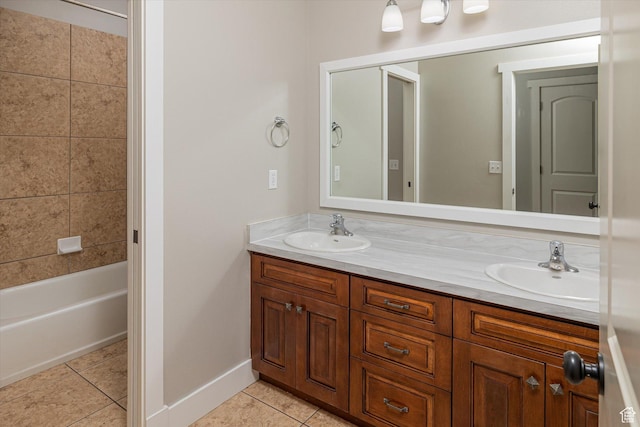 1697 S 3200 W, Logan, UT 84321 - bathroom featuring double vanity, tile patterned floors, baseboards, and bathing tub / shower combination