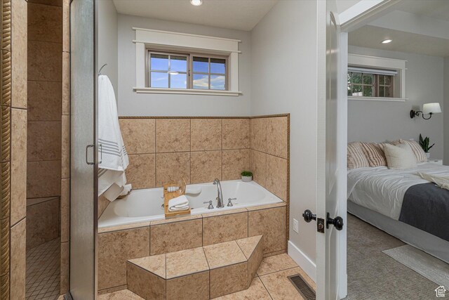 1697 S 3200 W, Logan, UT 84321 - bathroom featuring connected bathroom, a bath, plenty of natural light, tile patterned floors, and recessed lighting
