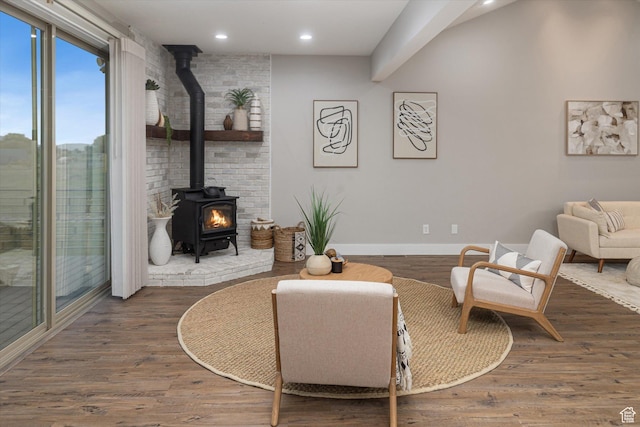 1697 S 3200 W, Logan, UT 84321 - living room featuring a wood stove, recessed lighting, baseboards, and wood finished floors