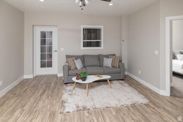 1697 S 3200 W, Logan, UT 84321 - living area with wood finished floors, baseboards, a ceiling fan, and recessed lighting