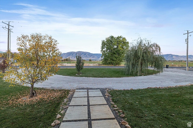 1697 S 3200 W, Logan, UT 84321 - view of community with a mountain view and a lawn