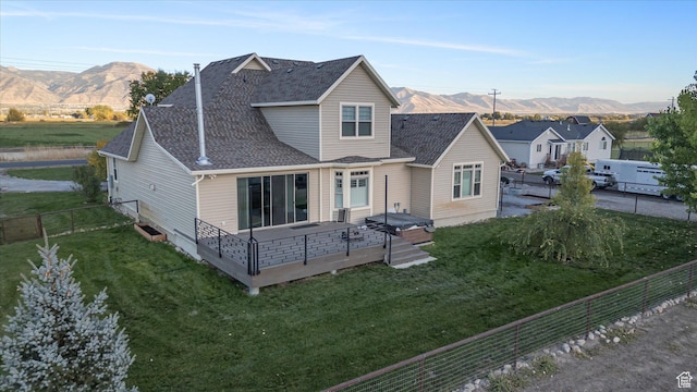 1697 S 3200 W, Logan, UT 84321 - rear view of house with a deck with mountain view and roof with shingles