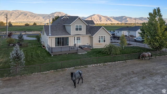 1697 S 3200 W, Logan, UT 84321 - traditional-style home featuring a view of countryside, a deck with mountain view, and roof with shingles