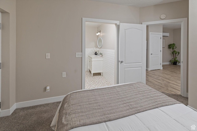 1697 S 3200 W, Logan, UT 84321 - bedroom featuring baseboards, a wainscoted wall, and connected bathroom