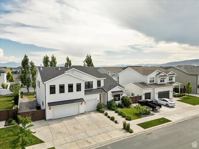 144 E 150 N, Vineyard, UT 84059 - view of front facade featuring a garage, a residential view, driveway, and a shingled roof