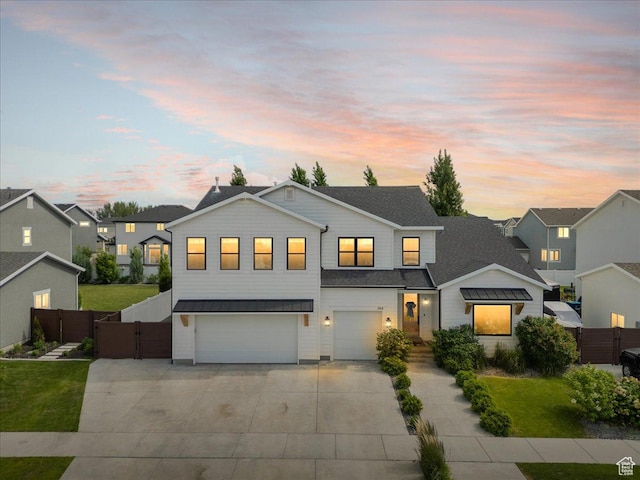 144 E 150 N, Vineyard, UT 84059 - view of front of home with concrete driveway, a garage, a gate, and a residential view