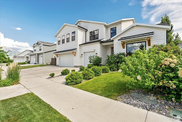144 E 150 N, Vineyard, UT 84059 - view of front facade with an attached garage, concrete driveway, and a front yard