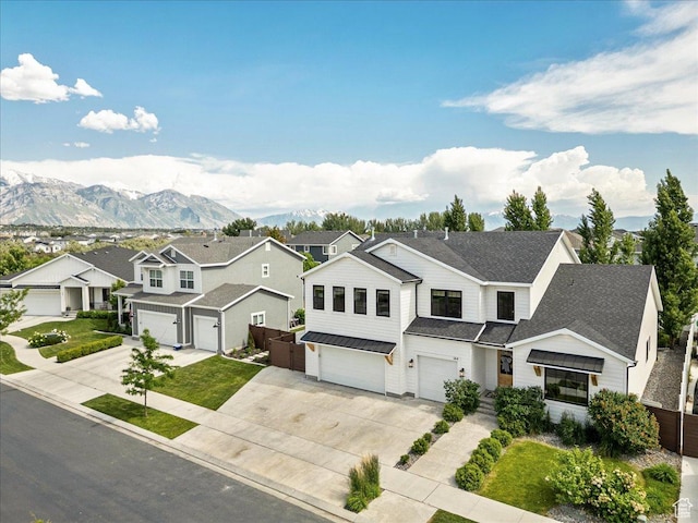 144 E 150 N, Vineyard, UT 84059 - view of front facade featuring a garage, concrete driveway, a residential view, a standing seam roof, and metal roof