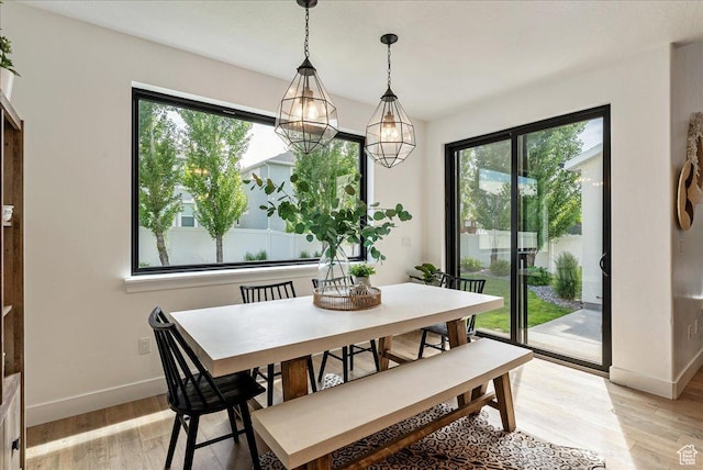 144 E 150 N, Vineyard, UT 84059 - dining area with plenty of natural light, light wood finished floors, baseboards, and a chandelier