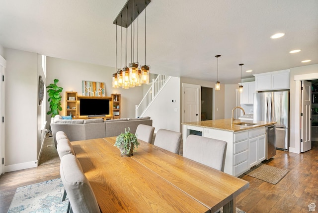 541 N Trek Rd, Saratoga Springs, UT 84045 - dining area featuring stairs, recessed lighting, dark wood-type flooring, and baseboards