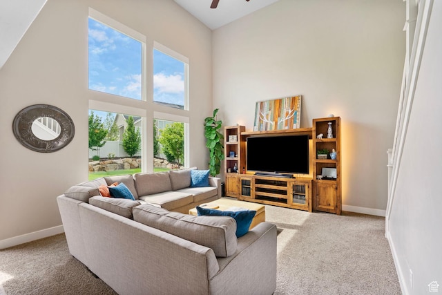 541 N Trek Rd, Saratoga Springs, UT 84045 - living area with carpet, baseboards, a ceiling fan, and a towering ceiling