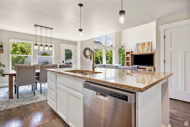 541 N Trek Rd, Saratoga Springs, UT 84045 - kitchen with dishwasher, a sink, healthy amount of natural light, a center island with sink, and a textured ceiling