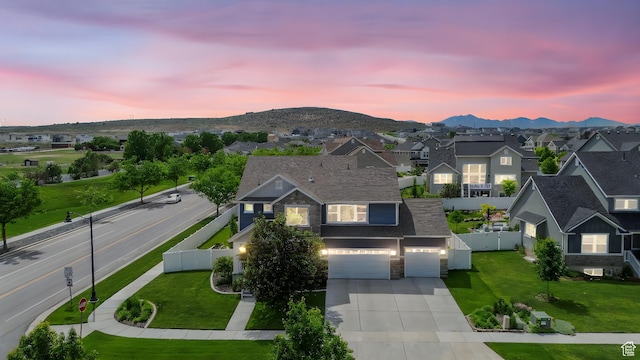 541 N Trek Rd, Saratoga Springs, UT 84045 - view of front of property with a residential view, concrete driveway, a mountain view, stone siding, and a garage
