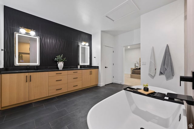 12719 S Outlaw Pl E, Draper, UT 84020 - full bathroom featuring double vanity, a freestanding bath, tile patterned floors, and baseboards
