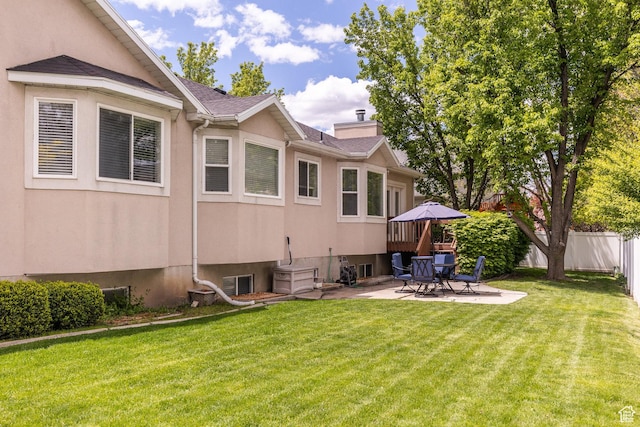 497 E Spruce Glen Rd, Murray, UT 84107 - rear view of property featuring a patio, a chimney, roof with shingles, and stucco siding