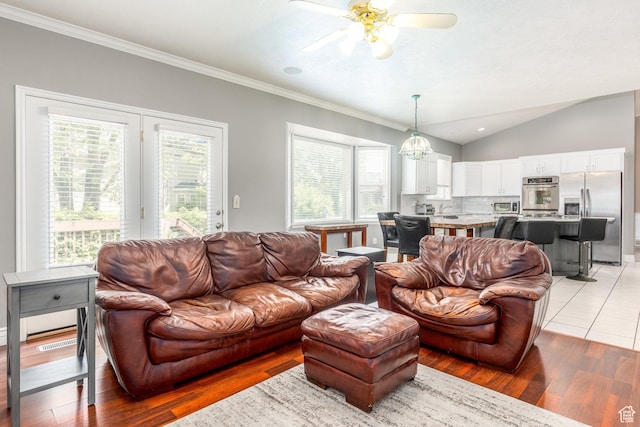 497 E Spruce Glen Rd, Murray, UT 84107 - living room with ceiling fan, healthy amount of natural light, ornamental molding, lofted ceiling, and light wood-type flooring