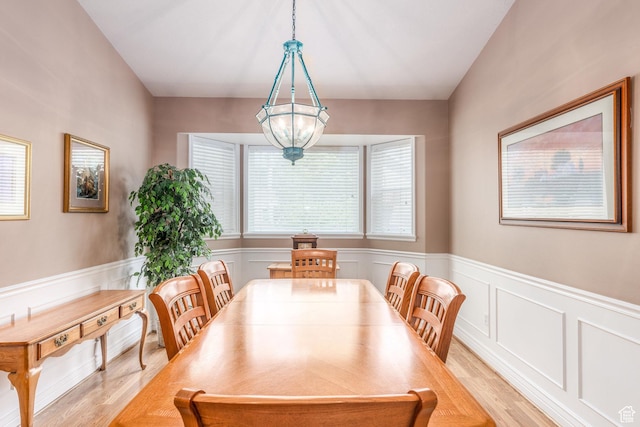 497 E Spruce Glen Rd, Murray, UT 84107 - dining room featuring light wood-style flooring, healthy amount of natural light, a wainscoted wall, and a decorative wall