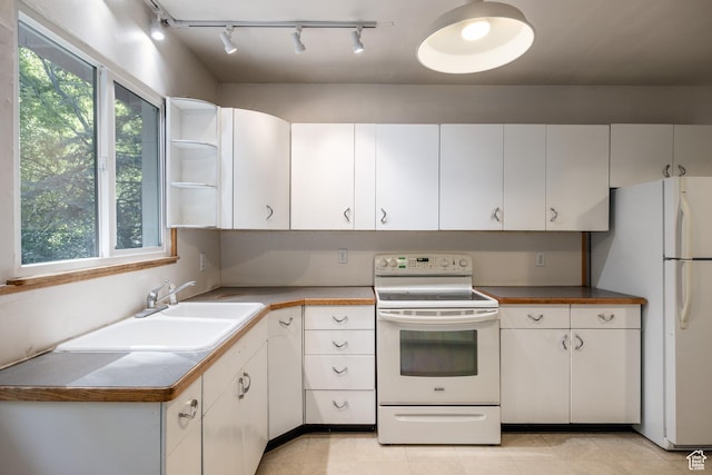 5623 E Emigration Canyon Rd, Emigration Canyon, UT 84108 - kitchen featuring white appliances, a sink, rail lighting, and white cabinetry