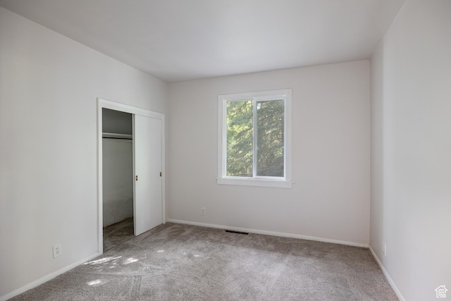5623 E Emigration Canyon Rd, Emigration Canyon, UT 84108 - unfurnished bedroom with carpet flooring, baseboards, and a closet