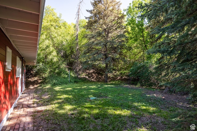5623 E Emigration Canyon Rd, Emigration Canyon, UT 84108 - view of grassy yard featuring a wooded view