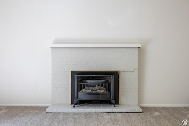 5623 E Emigration Canyon Rd, Emigration Canyon, UT 84108 - detailed view of carpet, baseboards, and a brick fireplace