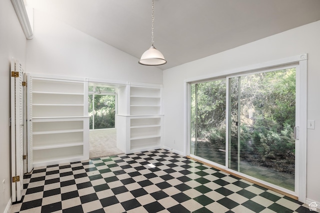 5623 E Emigration Canyon Rd, Emigration Canyon, UT 84108 - unfurnished room featuring healthy amount of natural light, tile patterned floors, lofted ceiling, and built in shelves