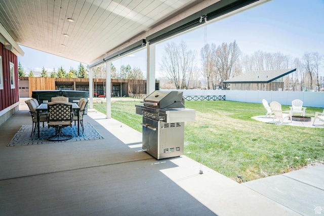 300 S 100th St W, Garden City, UT 84028 - view of patio / terrace featuring area for grilling, a hot tub, outdoor dining area, and a fire pit