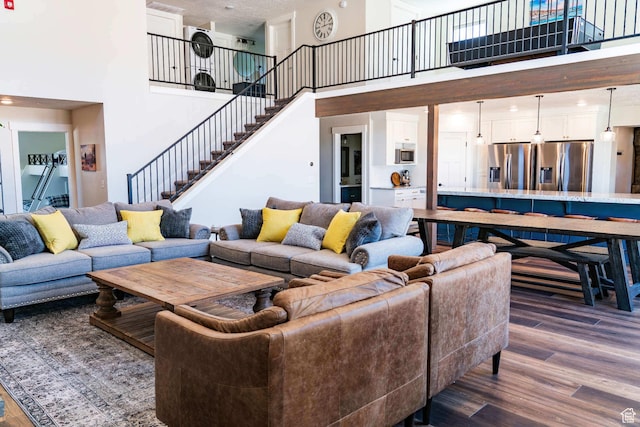 300 S 100th St W, Garden City, UT 84028 - living room with a towering ceiling, dark wood finished floors, and stairway