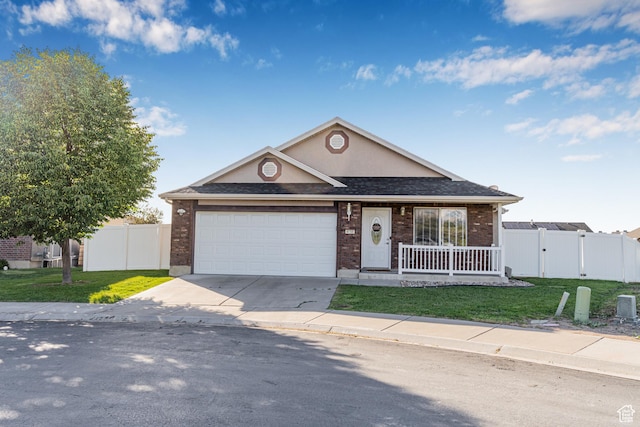 4155 S 3450 W, West Haven, UT 84401 - view of front of home with brick siding, a garage, concrete driveway, a gate, and covered porch