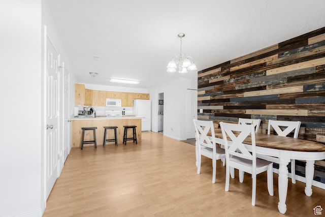 4155 S 3450 W, West Haven, UT 84401 - dining room featuring wooden walls, a chandelier, and light wood-style floors