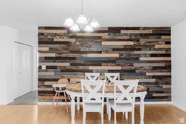 4155 S 3450 W, West Haven, UT 84401 - dining space featuring wooden walls, a chandelier, wood finished floors, and baseboards