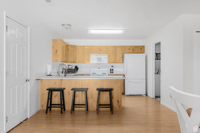 4155 S 3450 W, West Haven, UT 84401 - kitchen with white appliances, light wood finished floors, a peninsula, and light brown cabinets