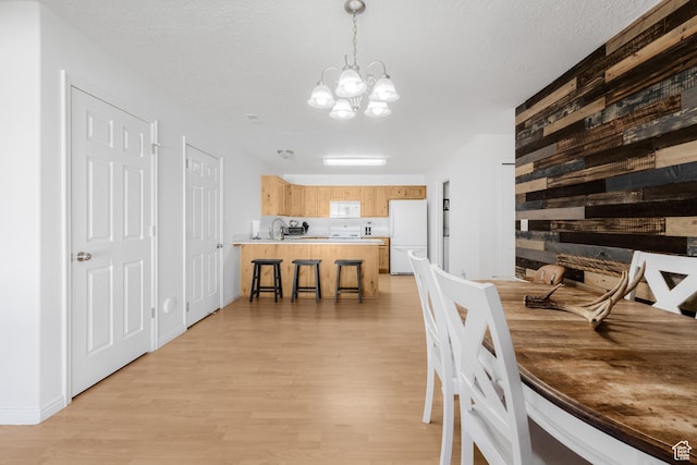 4155 S 3450 W, West Haven, UT 84401 - dining room featuring light wood-style flooring and a chandelier
