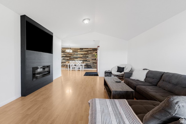 4155 S 3450 W, West Haven, UT 84401 - living room with lofted ceiling, light wood-type flooring, baseboards, and a large fireplace