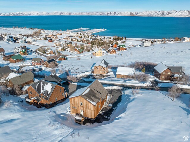 689 N Cambry Dr, Garden City, UT 84028 - snowy aerial view featuring a water view