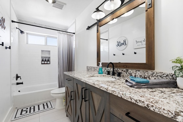 689 N Cambry Dr, Garden City, UT 84028 - full bathroom with vanity, shower / bath combo with shower curtain, toilet, and tile patterned floors