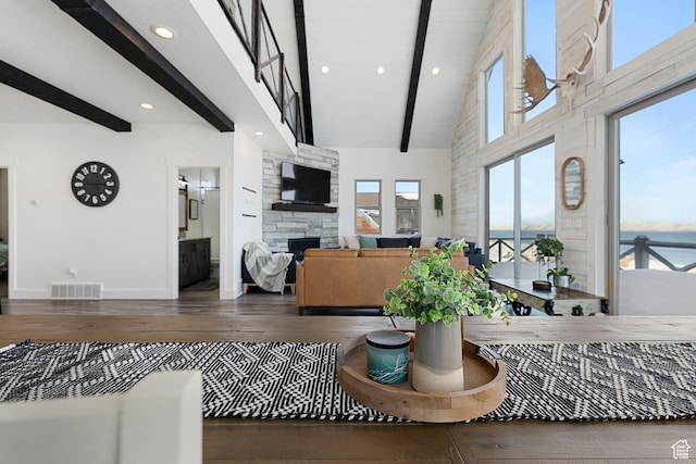 689 N Cambry Dr, Garden City, UT 84028 - living area featuring beam ceiling, hardwood / wood-style flooring, a fireplace, baseboards, and recessed lighting