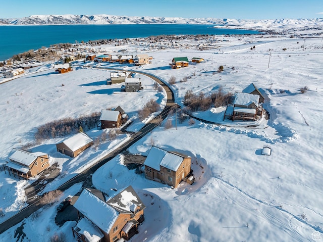 689 N Cambry Dr, Garden City, UT 84028 - snowy aerial view featuring a water and mountain view